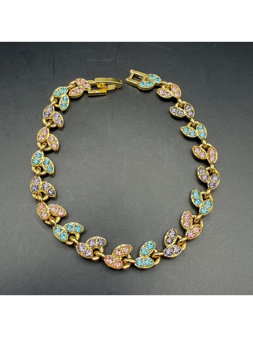 candy+clover Gold Tone Bracelet with Pink, Blue, and Purple Crystal Leaf Accents